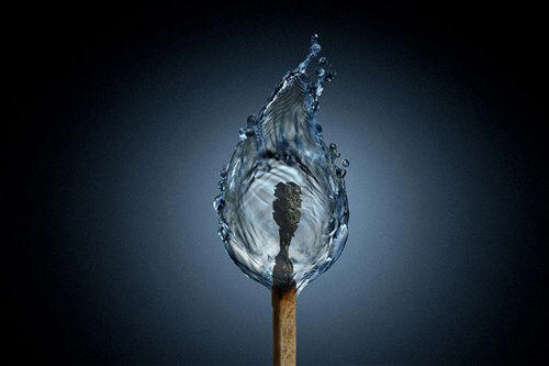 Lit match with a watery flame