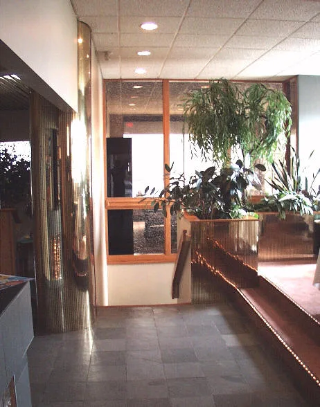 Top floor elevator lobby area and stairs to the lower floor